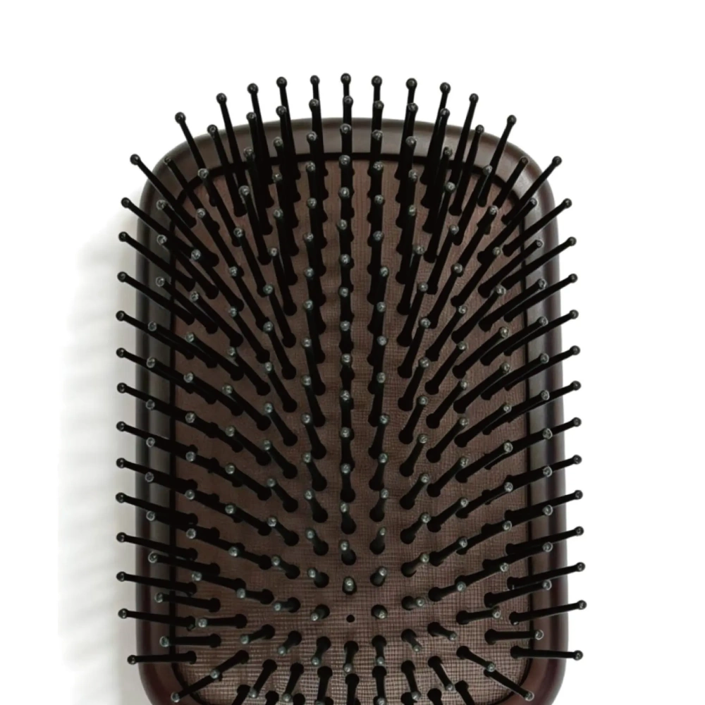 Black ball-tipped nylon pins of AIRMEI paddle hairbrush close-up