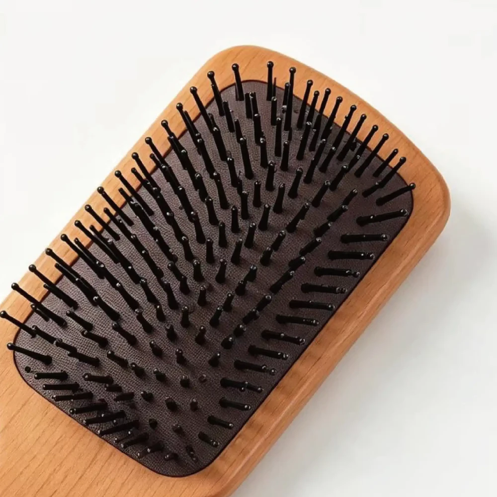 BSFL beech wood cushion hairbrush showing black nylon massage pins and cushion