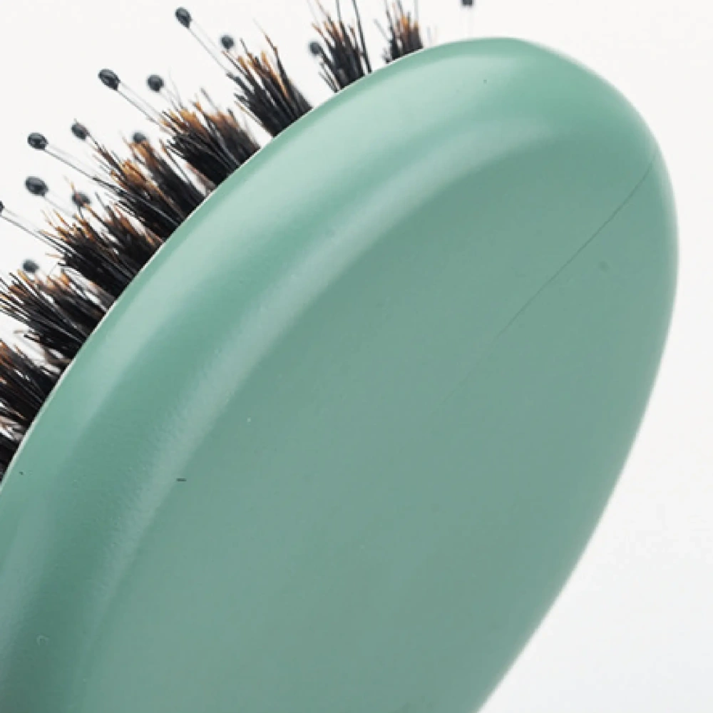 Smooth sage green matte back frame of BSFL wooden cushion hairbrush